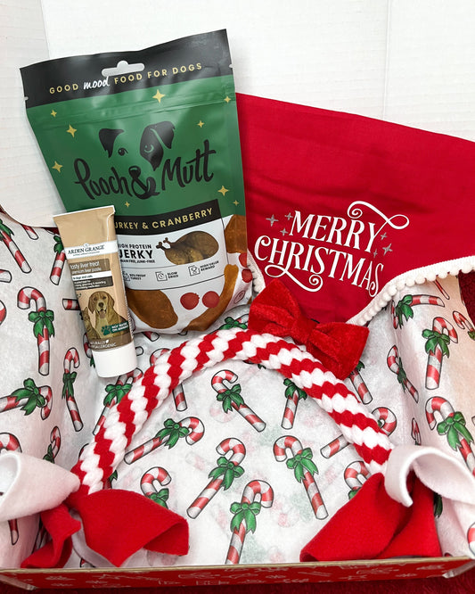 Includes dog Christmas treats, dog Christmas toy, dog bandana, dog bow tie