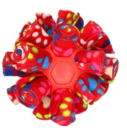 This is a snuffle enrichment cage ball, an enrichment game used for dog's to sniff their treats out.