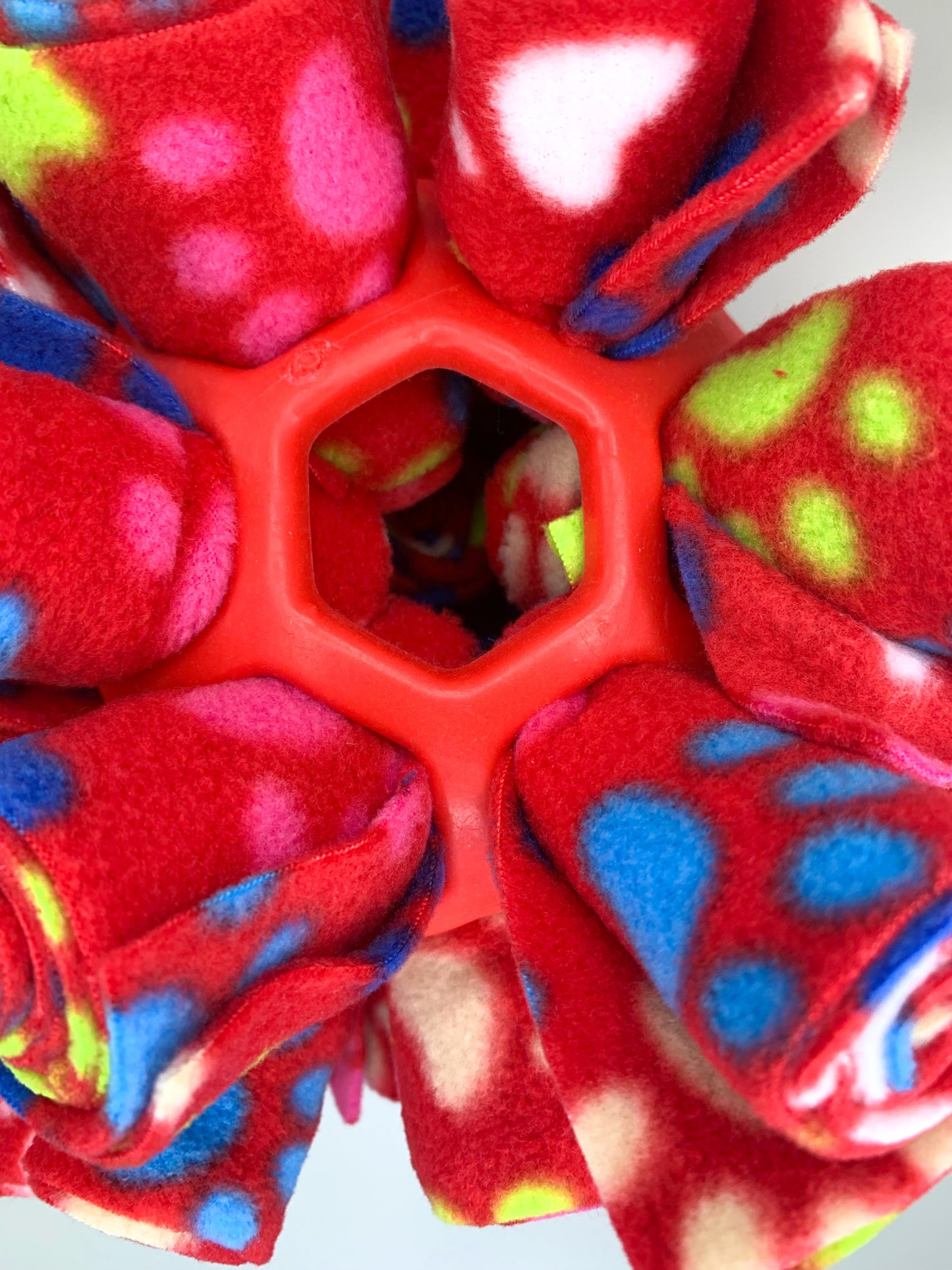 This is a snuffle enrichment cage ball, an enrichment game used for dog's to sniff their treats out.